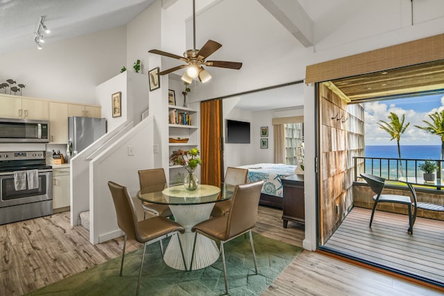 3700 Kamehameha Rd Unit H5, Princeville, HI 96722 - dining room featuring light wood-type flooring, high vaulted ceiling, ceiling fan, and stairway