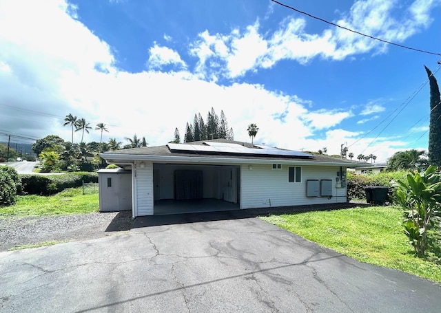 75-238 Hualalai Rd, Kailua-Kona, HI 96740 - view of front of property with solar panels, a front lawn, and driveway