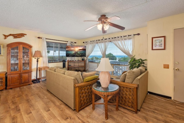 76-6132 Plumeria Rd, Kailua-Kona, HI 96740 - living area featuring a ceiling fan, a textured ceiling, and light wood-style flooring