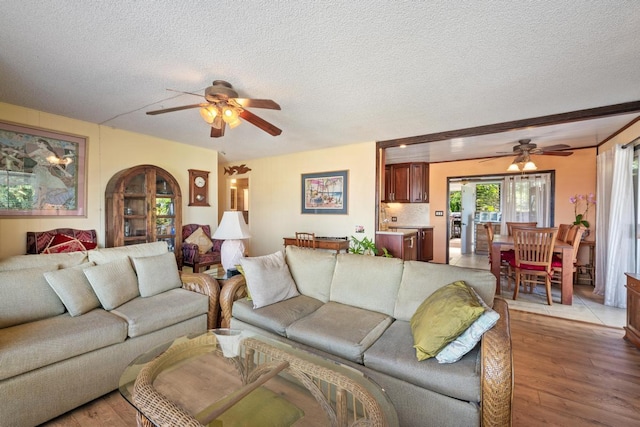 76-6132 Plumeria Rd, Kailua-Kona, HI 96740 - living area with ceiling fan, a textured ceiling, and light wood finished floors