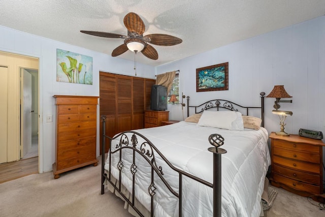76-6132 Plumeria Rd, Kailua-Kona, HI 96740 - bedroom featuring a closet, light colored carpet, a textured ceiling, and ceiling fan