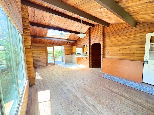 11-3927 8th St, Volcano, HI 96785 - unfurnished living room featuring wooden walls, wood-type flooring, a ceiling fan, a skylight, and wood ceiling