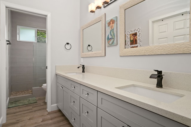 5970-A Heamoi Pl, Kapaa, HI 96746 - full bathroom with double vanity, tiled shower, and wood finished floors
