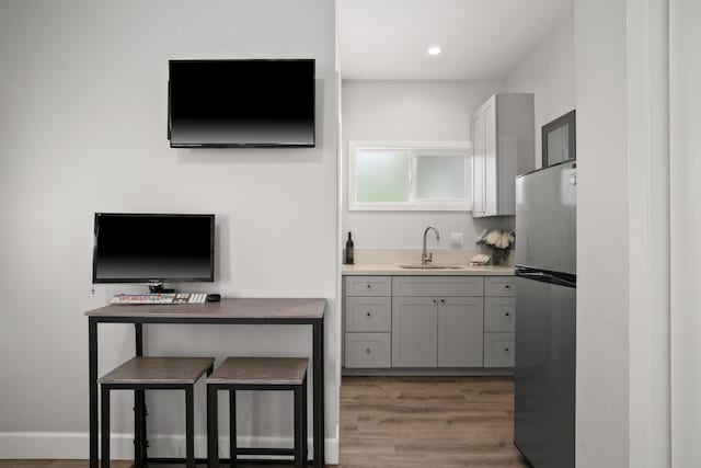 5970-A Heamoi Pl, Kapaa, HI 96746 - kitchen featuring freestanding refrigerator, gray cabinetry, wood finished floors, recessed lighting, and light countertops