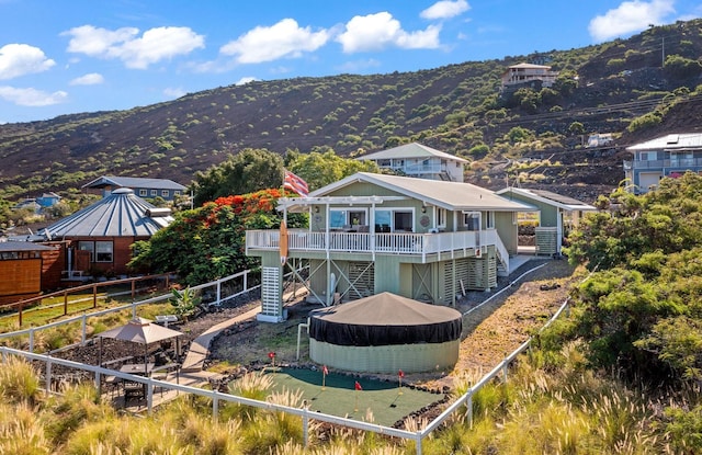 88-1557 Umi Ave, Captain Cook, HI 96704 - back of property featuring stairway and a deck with mountain view