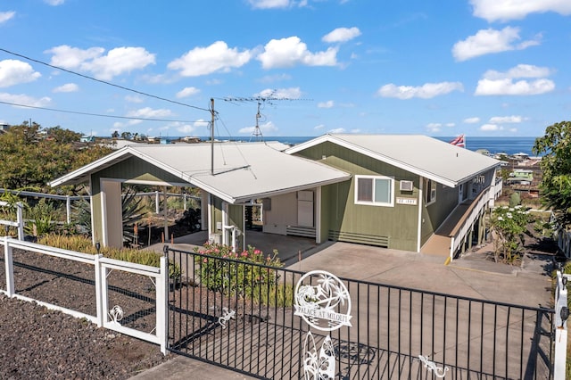 88-1557 Umi Ave, Captain Cook, HI 96704 - view of front facade featuring a fenced front yard, driveway, and a gate