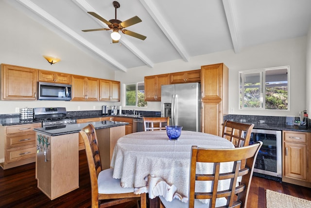 88-1557 Umi Ave, Captain Cook, HI 96704 - kitchen featuring appliances with stainless steel finishes, beverage cooler, a center island, dark countertops, and ceiling fan