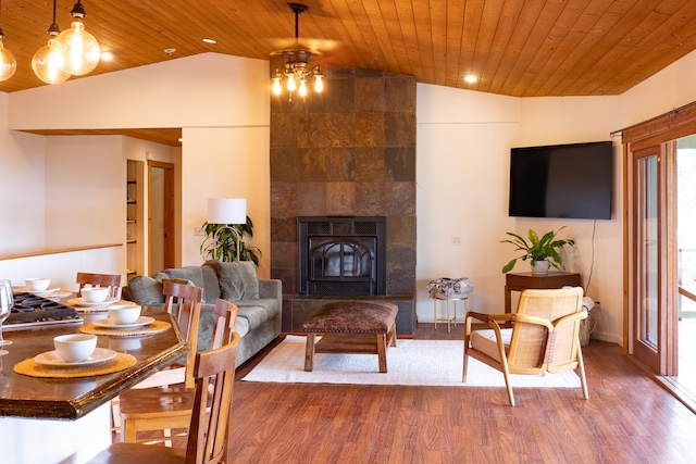 73-1599 Hao St, Kailua-Kona, HI 96740 - living room with lofted ceiling, wood ceiling, wood finished floors, and a tile fireplace