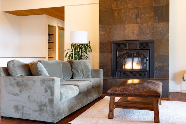 73-1599 Hao St, Kailua-Kona, HI 96740 - living area featuring built in shelves, a fireplace, and wood finished floors