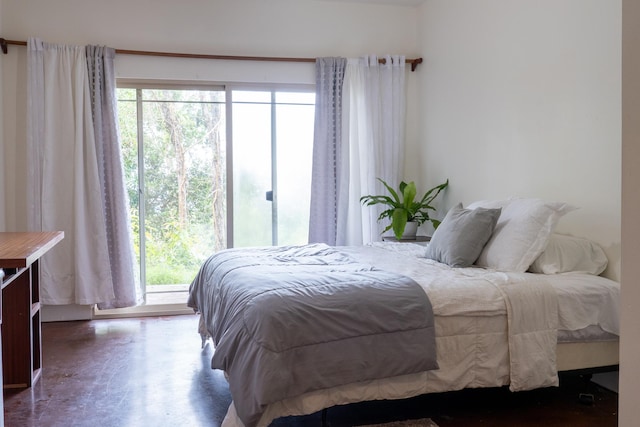 73-1599 Hao St, Kailua-Kona, HI 96740 - bedroom with multiple windows, finished concrete floors, and access to exterior