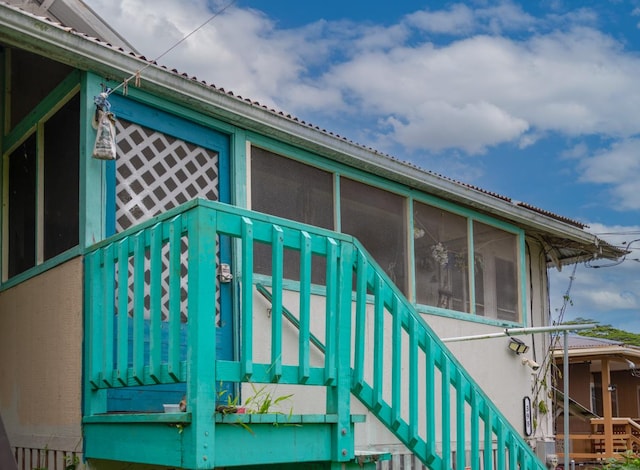 398 Ohai St, Hilo, HI 96720 - view of property exterior with stairway and a sunroom
