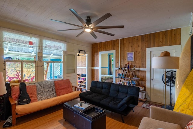398 Ohai St, Hilo, HI 96720 - living area featuring wood finished floors, ceiling fan, and wood walls
