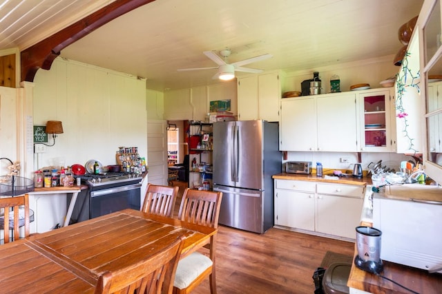 398 Ohai St, Hilo, HI 96720 - kitchen with appliances with stainless steel finishes, ceiling fan, light wood finished floors, white cabinetry, and light countertops