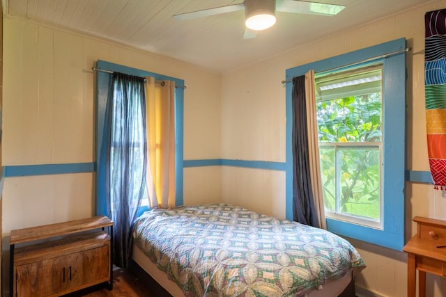 398 Ohai St, Hilo, HI 96720 - bedroom featuring multiple windows, a ceiling fan, and wood finished floors