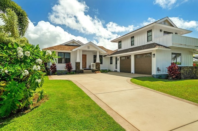 5414 Nakoa St, Koloa, HI 96756 - modern inspired farmhouse with board and batten siding, a garage, a front yard, and concrete driveway