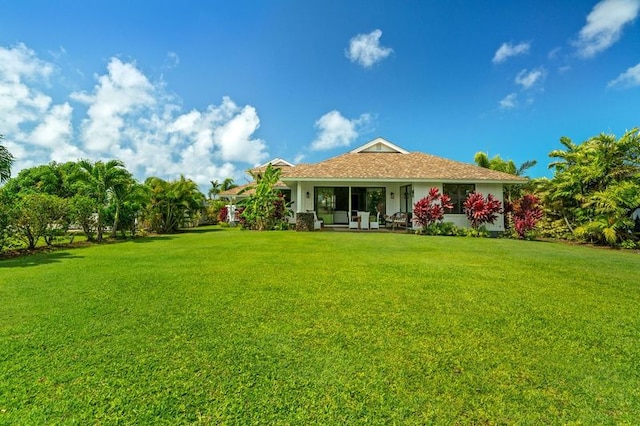 5414 Nakoa St, Koloa, HI 96756 - rear view of property featuring a yard