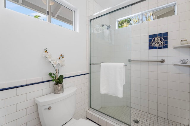 75-217 Nani Kailua Dr Unit 157, Kailua-Kona, HI 96740 - full bath featuring a stall shower, tile walls, and wainscoting