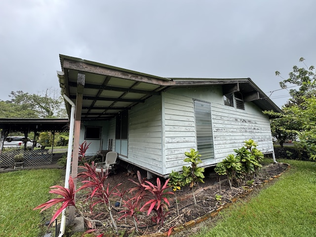 18-7855 Kulani Rd, Mountain View, HI 96771 - view of property exterior featuring a yard and a carport