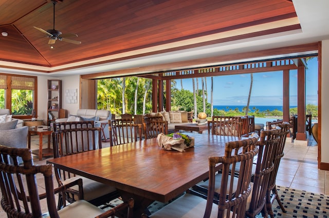 72-106 Hainoa Pl Unit 4, Kailua-Kona, HI 96740 - dining space featuring a tray ceiling, ceiling fan, wooden ceiling, a water view, and light tile patterned flooring