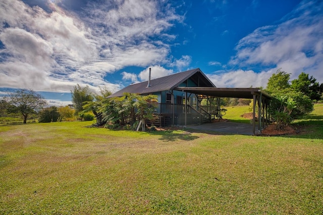 45-3463 Kahana Dr, Honokaa, HI 96727 - view of grassy yard featuring a carport and stairs