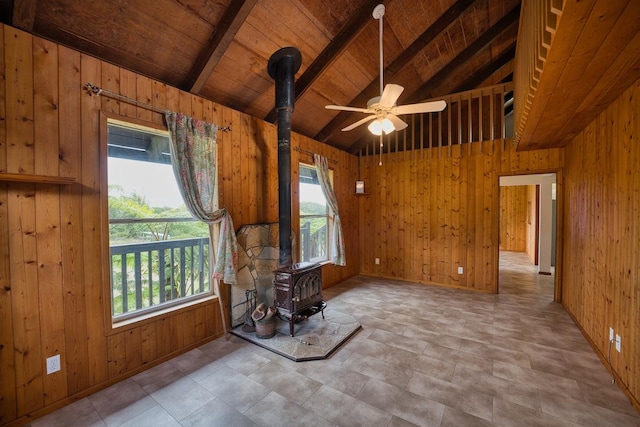 45-3463 Kahana Dr, Honokaa, HI 96727 - living room featuring a wood stove, wooden walls, a ceiling fan, and wooden ceiling