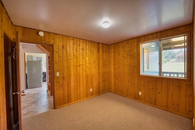 45-3463 Kahana Dr, Honokaa, HI 96727 - empty room featuring wooden walls and light carpet