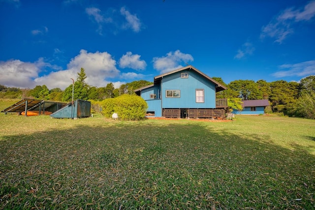 45-3463 Kahana Dr, Honokaa, HI 96727 - back of house with a lawn