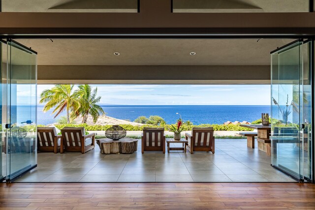 59-217 Lele Naia Dr, Kamuela, HI 96743 - living area with a water view and wood finished floors