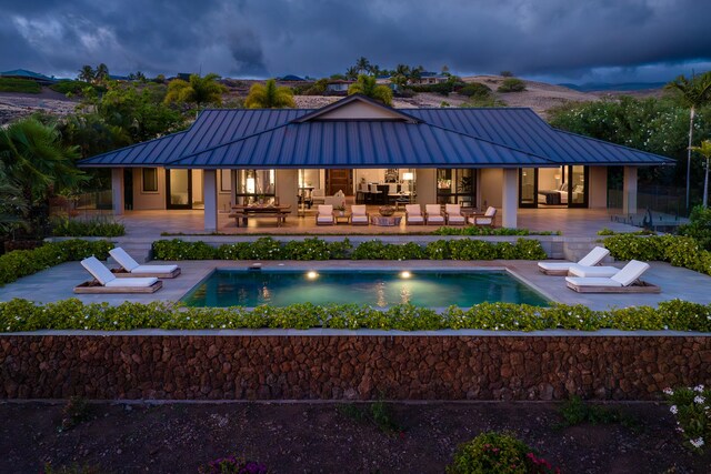 59-217 Lele Naia Dr, Kamuela, HI 96743 - rear view of house with an outdoor living space, a standing seam roof, and a metal roof