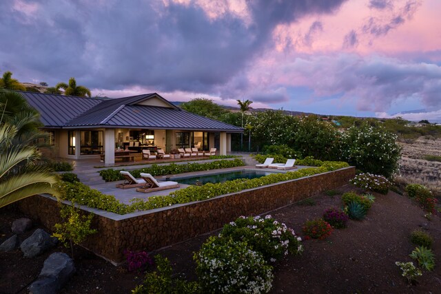 59-217 Lele Naia Dr, Kamuela, HI 96743 - back of property featuring a patio area, a standing seam roof, a metal roof, and an outdoor pool