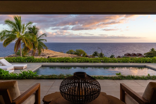 59-217 Lele Naia Dr, Kamuela, HI 96743 - patio terrace at dusk with a water view, an outdoor pool, and a patio