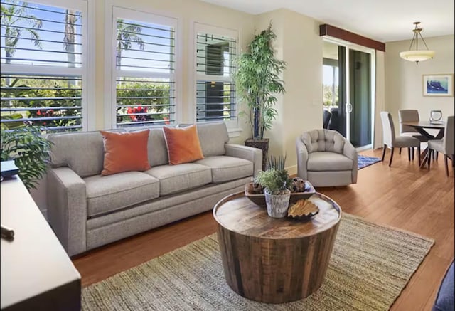 2611 Kiahuna Plantation Dr Unit 1H, Koloa, HI 96756 - living room with wood finished floors and healthy amount of natural light
