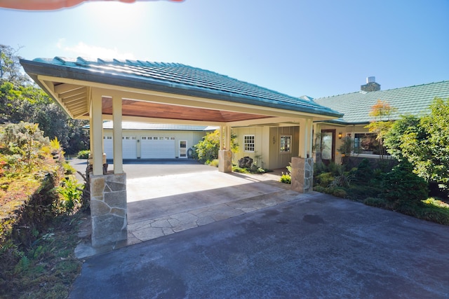 73-4310 Huehue St, Kailua-Kona, HI 96740 - view of front of house with a tiled roof, driveway, a garage, and a chimney