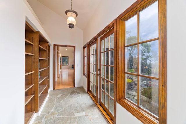73-4310 Huehue St, Kailua-Kona, HI 96740 - hallway with light stone finish flooring, french doors, and lofted ceiling