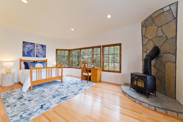 73-4310 Huehue St, Kailua-Kona, HI 96740 - bedroom featuring a wood stove, hardwood / wood-style flooring, recessed lighting, and vaulted ceiling