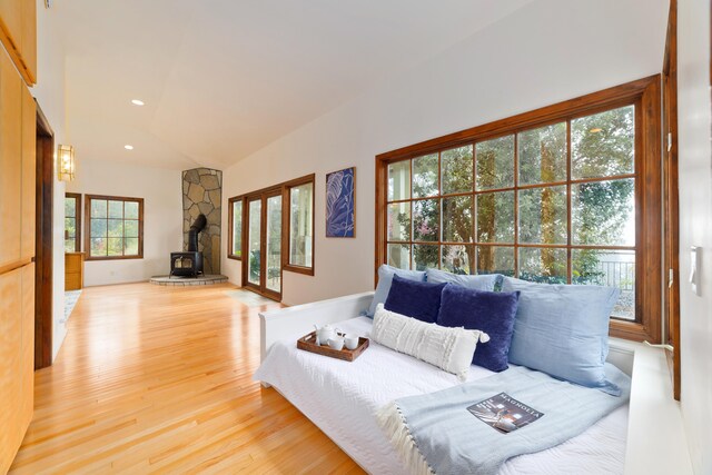 73-4310 Huehue St, Kailua-Kona, HI 96740 - living area with a wood stove, light wood-style flooring, vaulted ceiling, and recessed lighting