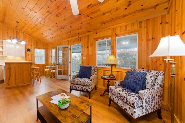 73-4310 Huehue St, Kailua-Kona, HI 96740 - living room with vaulted ceiling, healthy amount of natural light, wooden walls, light wood-type flooring, and a ceiling fan