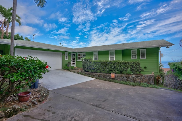 77-6459 Pualani St, Kailua-Kona, HI 96740 - ranch-style home with concrete driveway and an attached garage