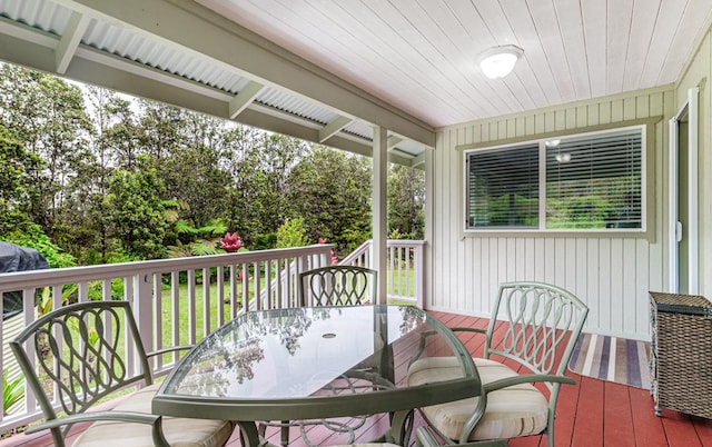 11-3082 Pa Alii St, Volcano, HI 96785 - wooden deck with outdoor dining area and view of scattered trees