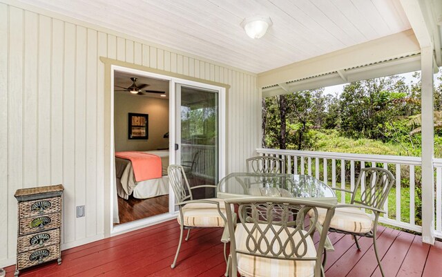 11-3082 Pa Alii St, Volcano, HI 96785 - sunroom / solarium with hardwood / wood-style floors, a deck, wooden walls, and healthy amount of natural light