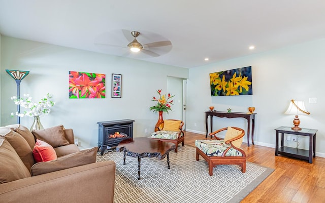 11-3082 Pa Alii St, Volcano, HI 96785 - living room featuring a wood stove, a ceiling fan, light wood-style flooring, and recessed lighting