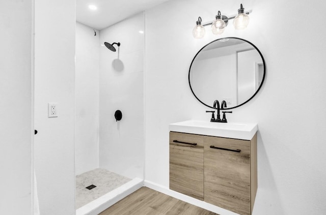 73-4338 Napoo Pl, Kailua-Kona, HI 96740 - full bath featuring vanity, a tile shower, and wood finished floors