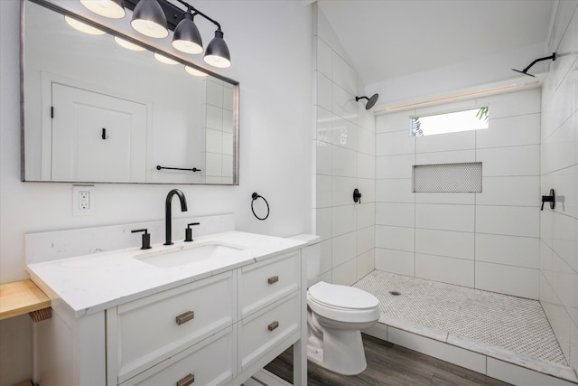 73-4338 Napoo Pl, Kailua-Kona, HI 96740 - bathroom featuring vanity, tiled shower, and wood finished floors