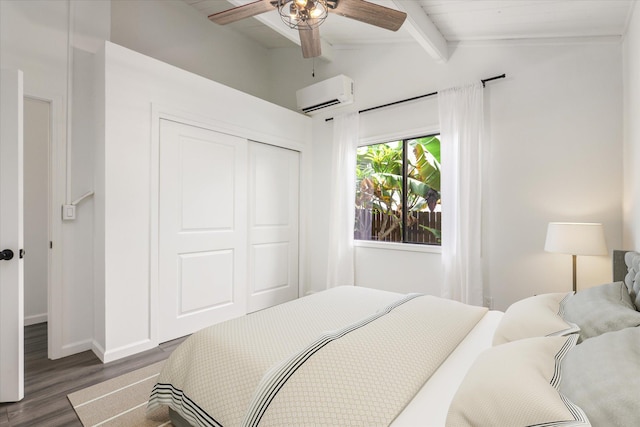 73-4338 Napoo Pl, Kailua-Kona, HI 96740 - bedroom featuring a wall unit AC, wood finished floors, a closet, and a ceiling fan