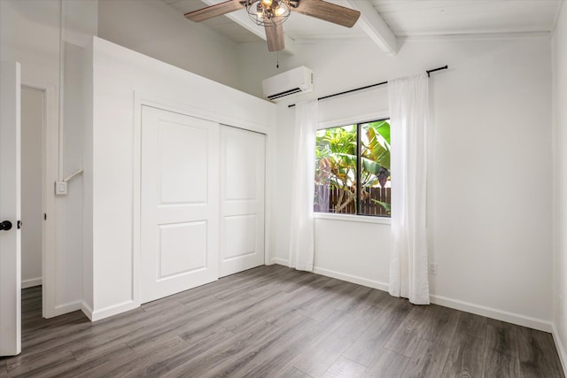 73-4338 Napoo Pl, Kailua-Kona, HI 96740 - unfurnished bedroom featuring an AC wall unit, wood finished floors, a closet, and a ceiling fan