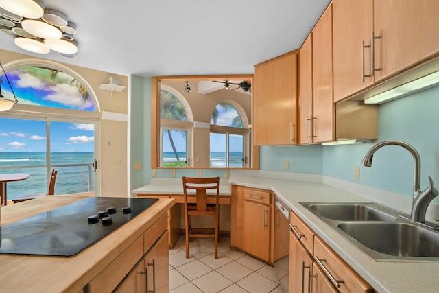 4491 Kikiaola Pl, Kekaha, HI 96752 - kitchen with black electric stovetop, dishwasher, light tile patterned flooring, and ceiling fan