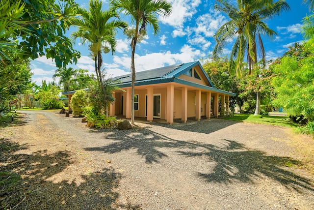 4491 Kikiaola Pl, Kekaha, HI 96752 - view of front of home with a metal roof and dirt driveway