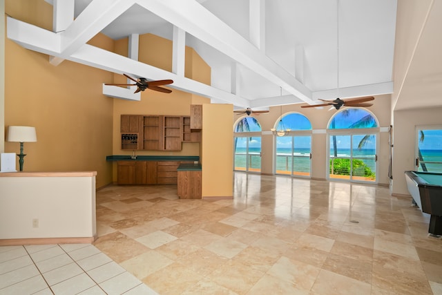 4491 Kikiaola Pl, Kekaha, HI 96752 - kitchen featuring high vaulted ceiling, ceiling fan, brown cabinets, open shelves, and open floor plan