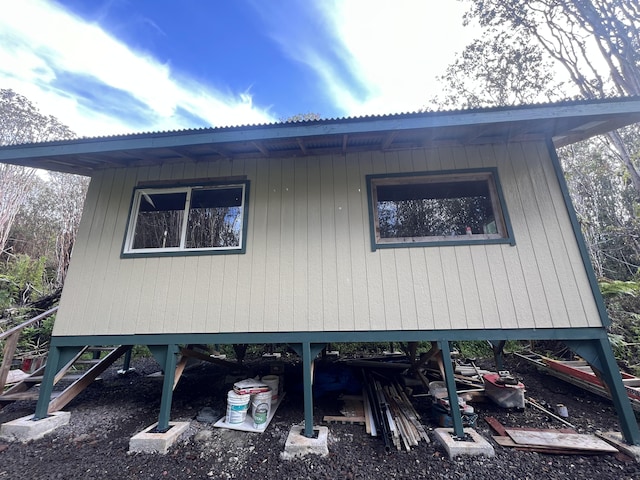 18-2040 Pomaikai St, Volcano, HI 96785 - view of property exterior with a metal roof