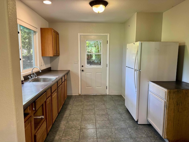 78-6694 Mamalahoa Hwy, Holualoa, HI 96740 - kitchen with brown cabinetry, healthy amount of natural light, freestanding refrigerator, and recessed lighting